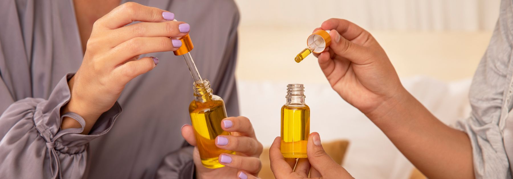 people using bottle of olive oil ear drops