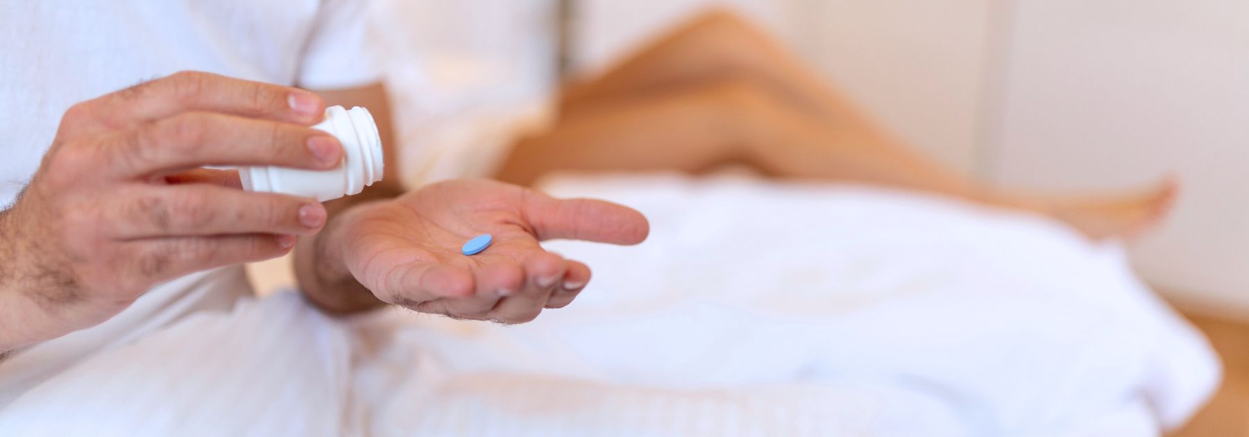 man taking erectile dysfunction tablet 