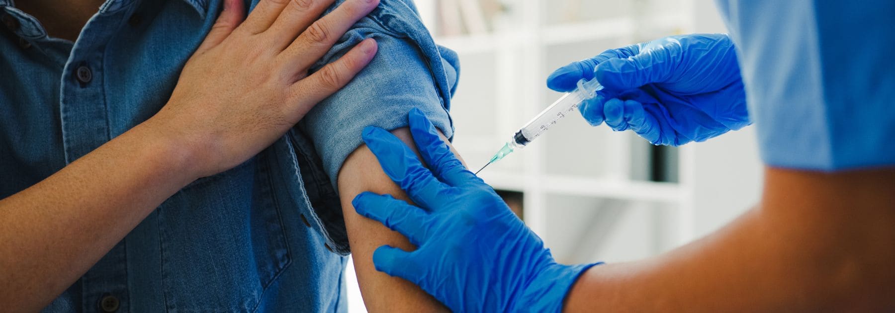 receiving a travel vaccine at a travel clinic in London
